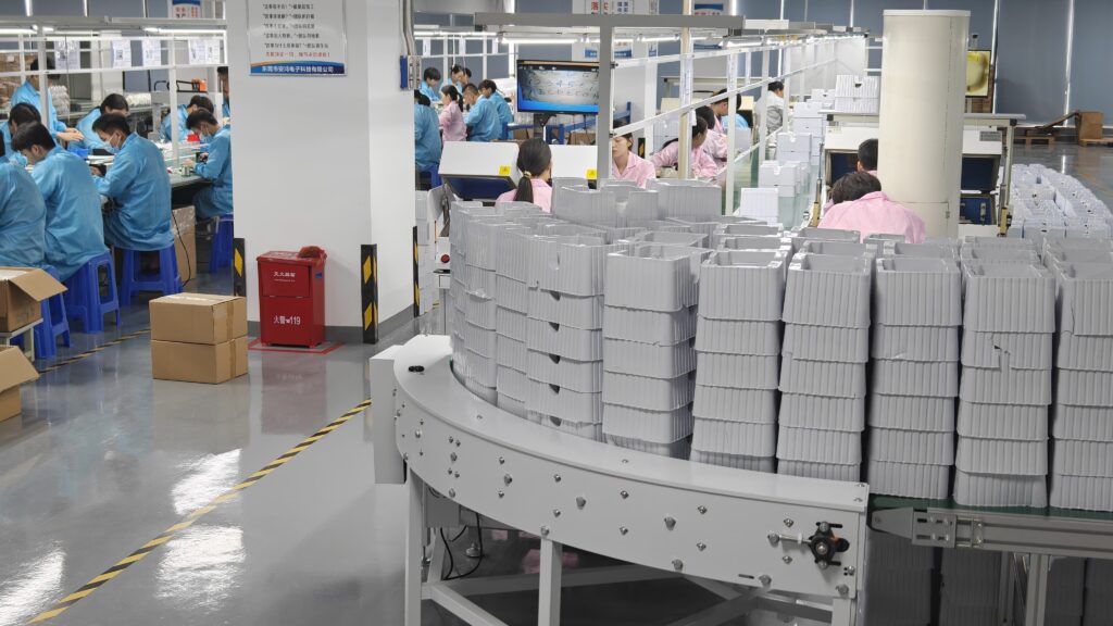 Mid-range view of an ANHONG baby monitor assembly line