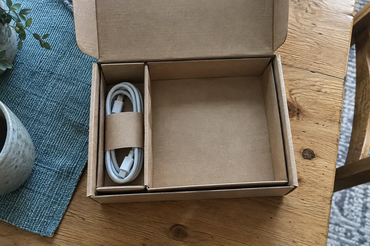 Plain carton divider and separate cable sleeve showing protective layers