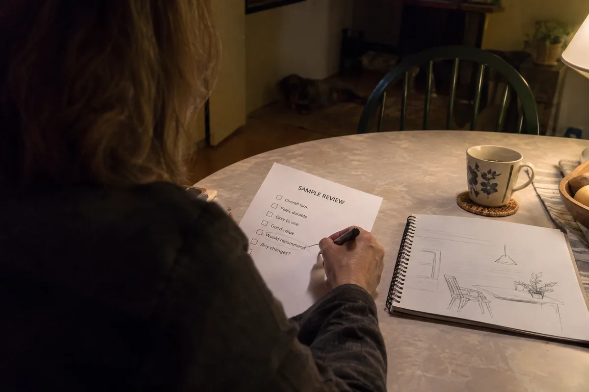 A buyer marking viewing-task questions in a night-vision sample review brief